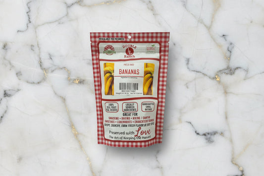 Crunchy freeze-dried banana chips from Double L Ranch, golden and crisp, shown in a close-up view.