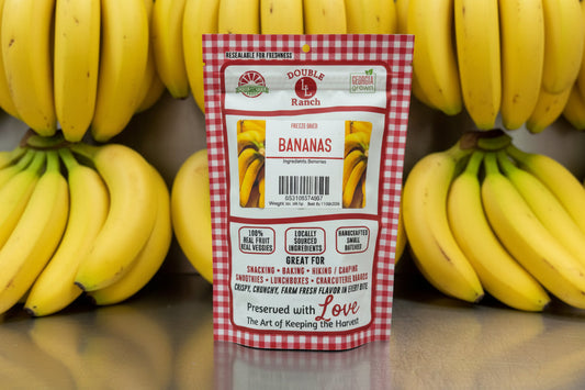 Freeze dried banana chips from Double L Ranch, showing crispy, golden banana slices in a clear container.