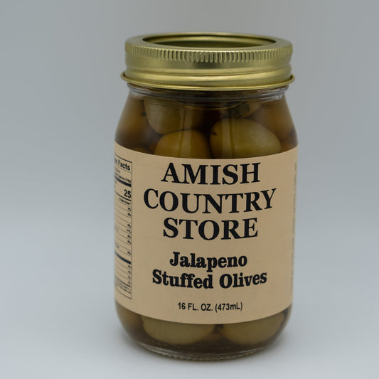 Canned jalapeno stuffed olives in a 16 oz jar from Amish Country Store, showing green olives filled with spicy jalapeno peppers.