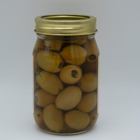 Canned jalapeno stuffed olives in a 16 oz jar from Amish Country Store, showing green olives filled with spicy jalapenos.