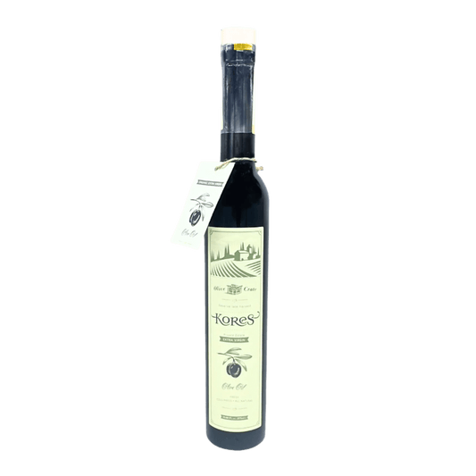 Kores Estate Greek extra virgin olive oil by Olive Crate, bottled in a dark glass bottle with a green label and gold accents.