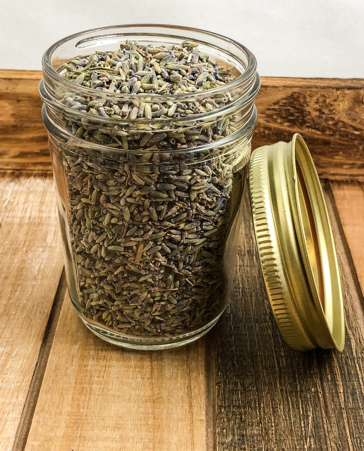 Small herbal jar with lavender dried herbs by HerbalRoseApothecary, featuring a white and wood-colored design.