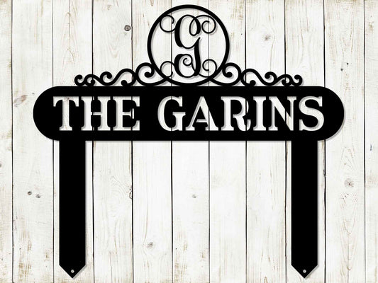 Black Monogram Scroll Yard and Garden Sign by Lewis Design Company, outdoor patio and garden art, 22x19 inches, decorative metal design.