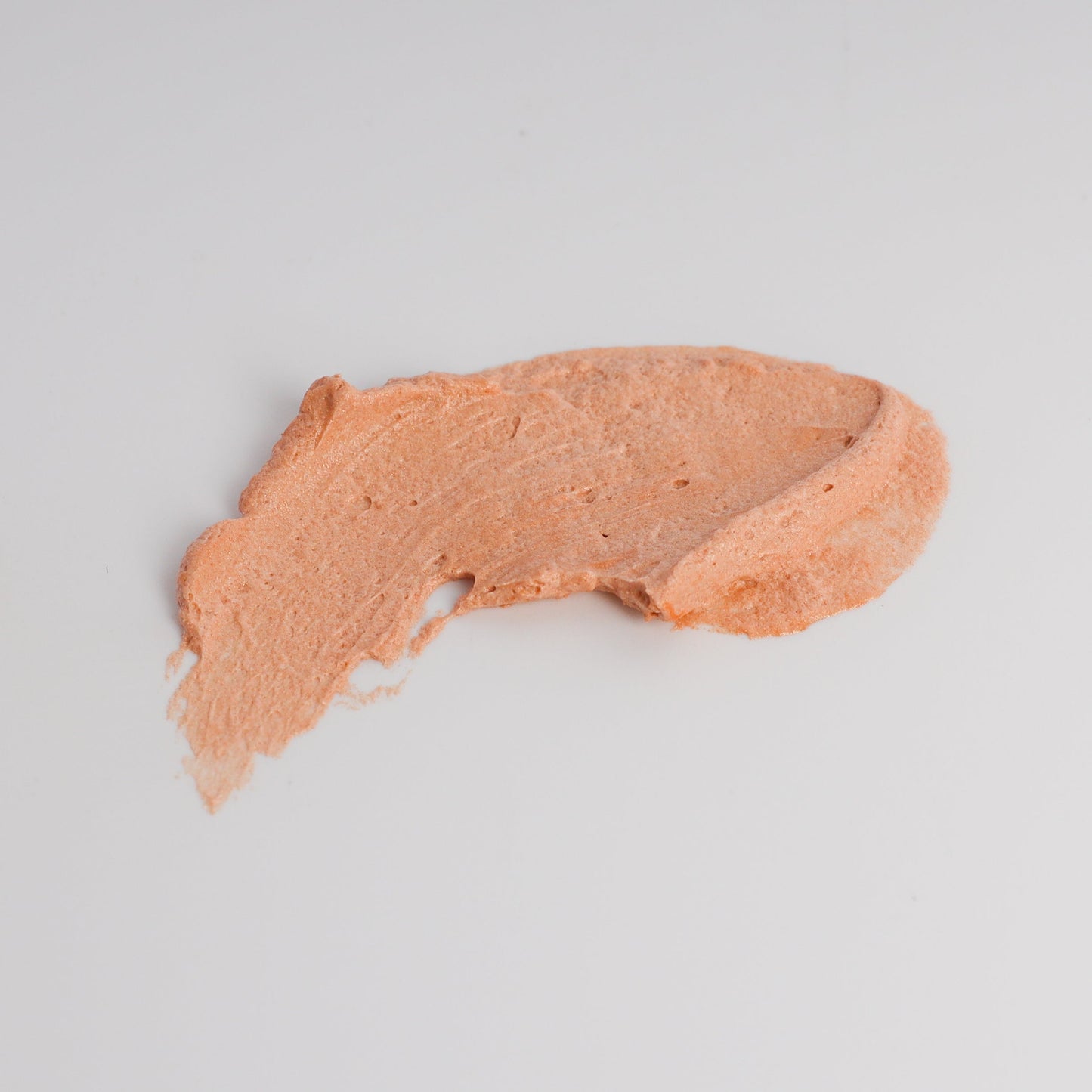 Lady May Tallow luminous bronze whipped tallow moisturizer applied smoothly to skin in a 9 oz body cream container.