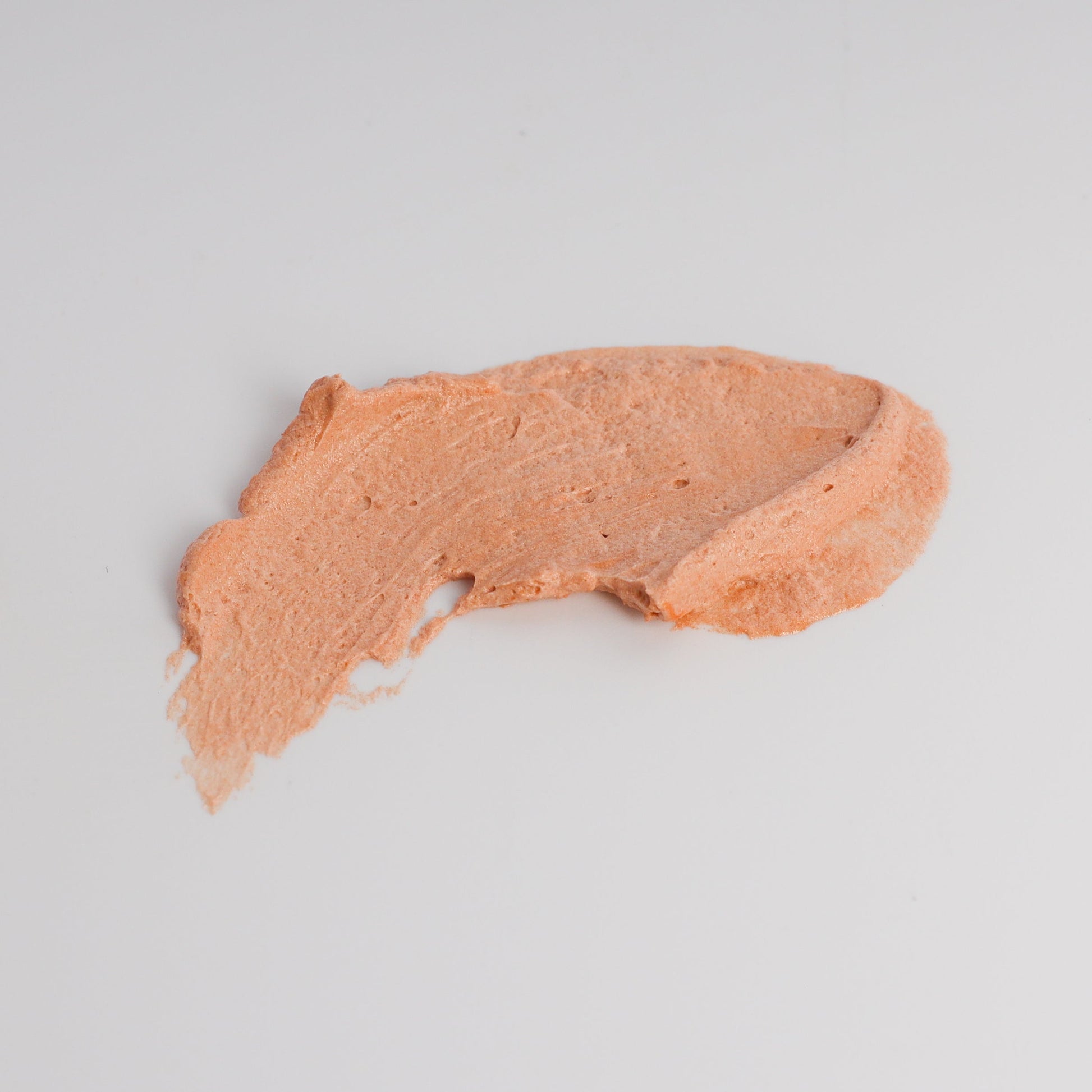 Lady May Tallow luminous bronze whipped tallow moisturizer applied smoothly to skin in a 9 oz body cream container.