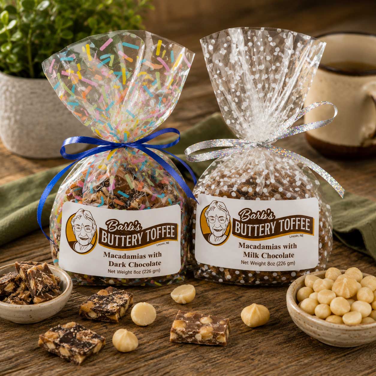 Homemade milk chocolate toffee with macadamia nuts from Barb's Buttery Toffee, 8 oz, featuring crunchy toffee and rich chocolate.