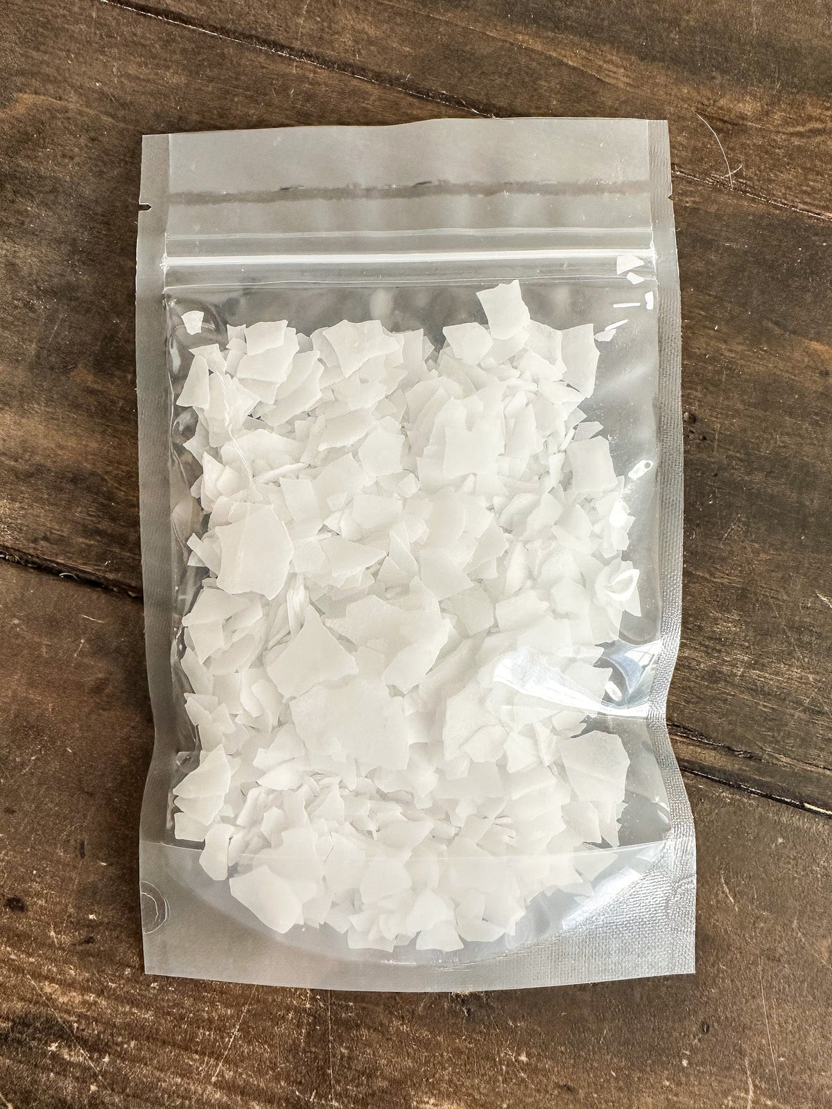 HerbalRoseApothecary magnesium flakes salts and oats in a bowl, natural mineral magnesium flakes for relaxation and bath soaks.