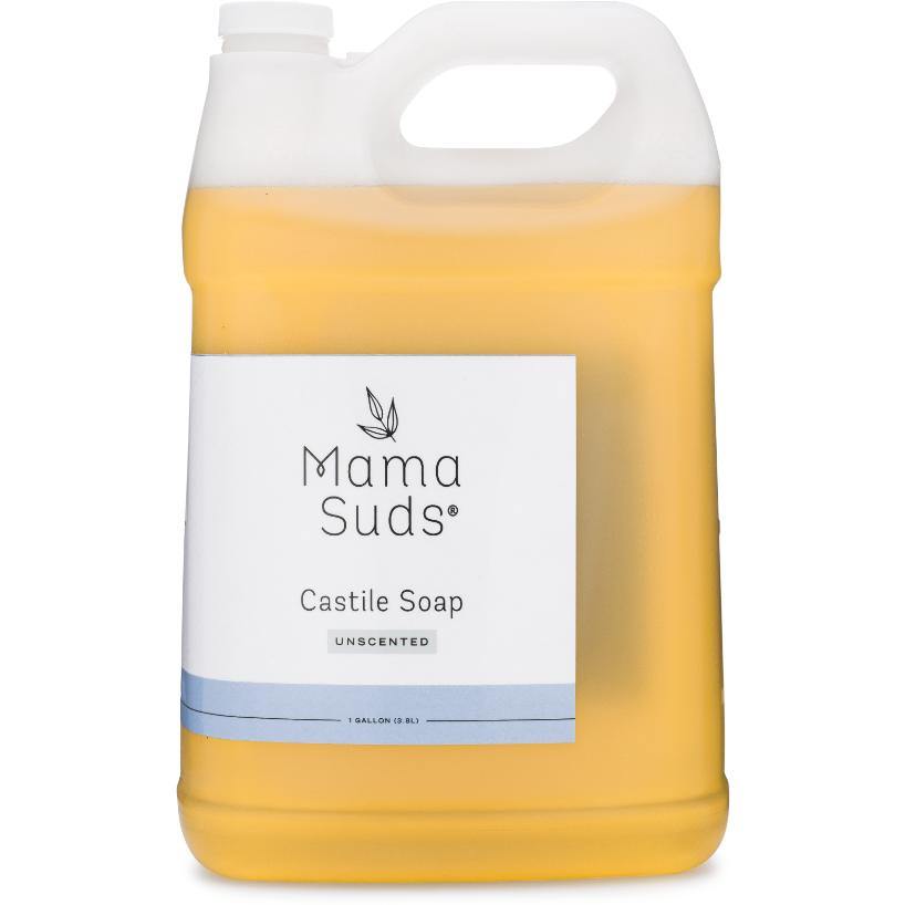 A clear plastic gallon jug of MamaSuds Castile Liquid Soap, an all-purpose unscented cleaner with a white label, blue accents, handle, and screw cap. Light yellow soap visible inside the jug.