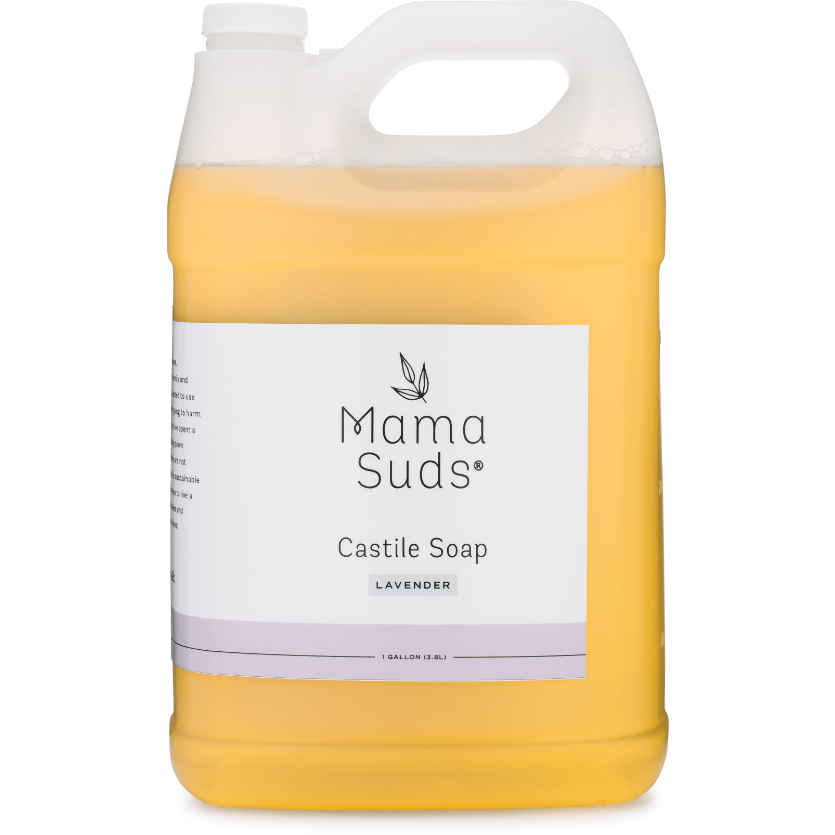 A gallon jug of MamaSuds Castile Liquid Soap in lavender, made with pure essential oils. Features a white label with black text, top handle, and contains light yellow all-purpose cleaning soap.