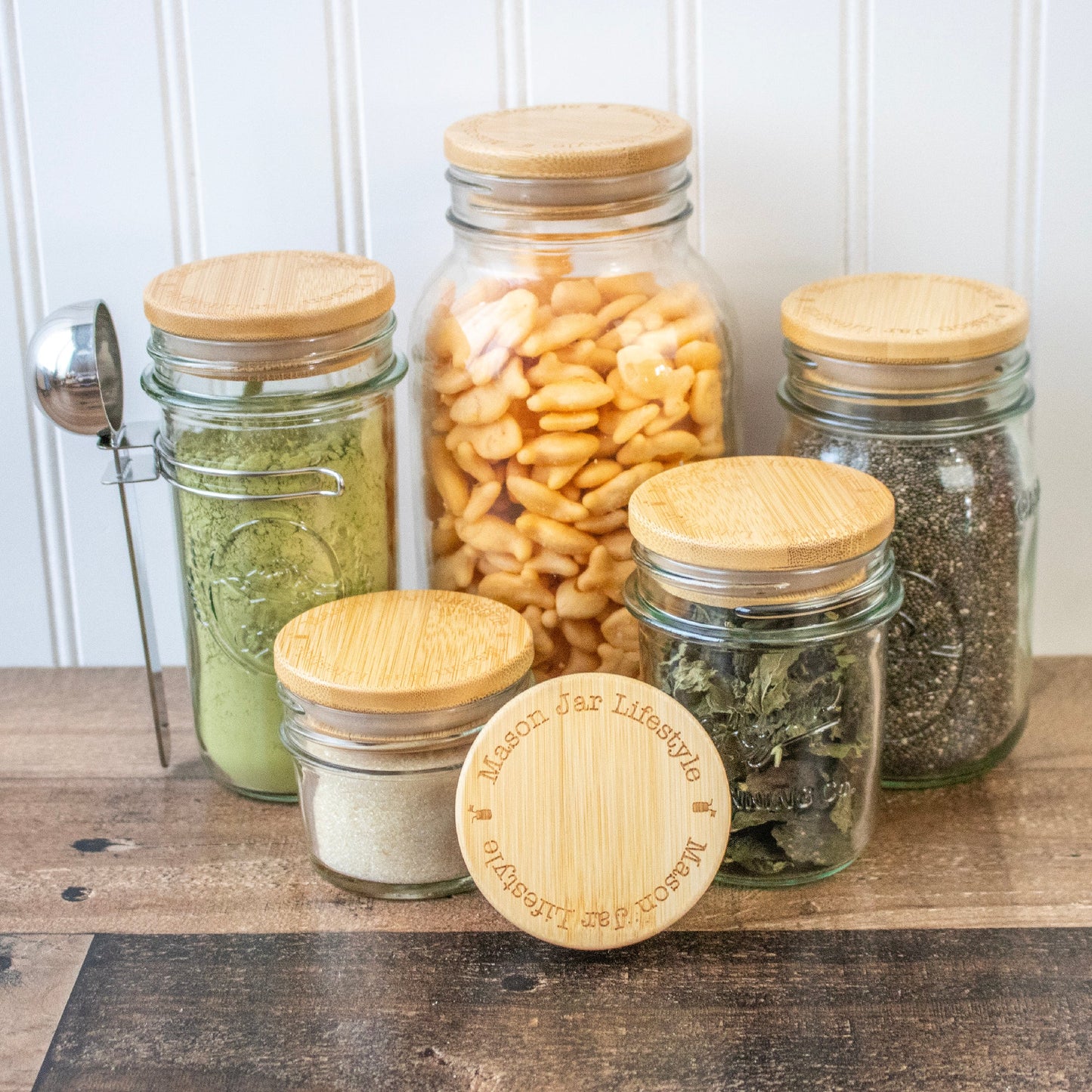 Bamboo storage stopper lids for Mason jars, ideal for snacks, pantry, and meal prep, by Mason Jar Lifestyle.