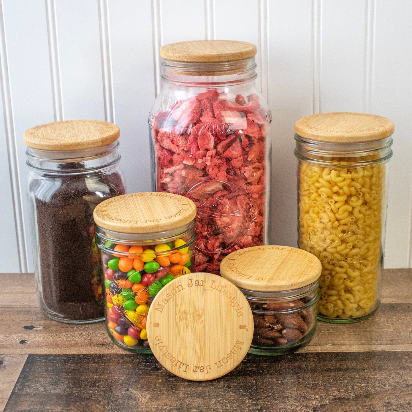 Bamboo storage lids for Mason jars, perfect for snacks, pantry, and meal prep organization, by Mason Jar Lifestyle.