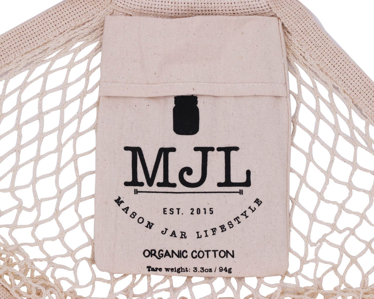 Organic cotton string tote bag with front pocket by Mason Jar Lifestyle, showing its natural texture and simple design.