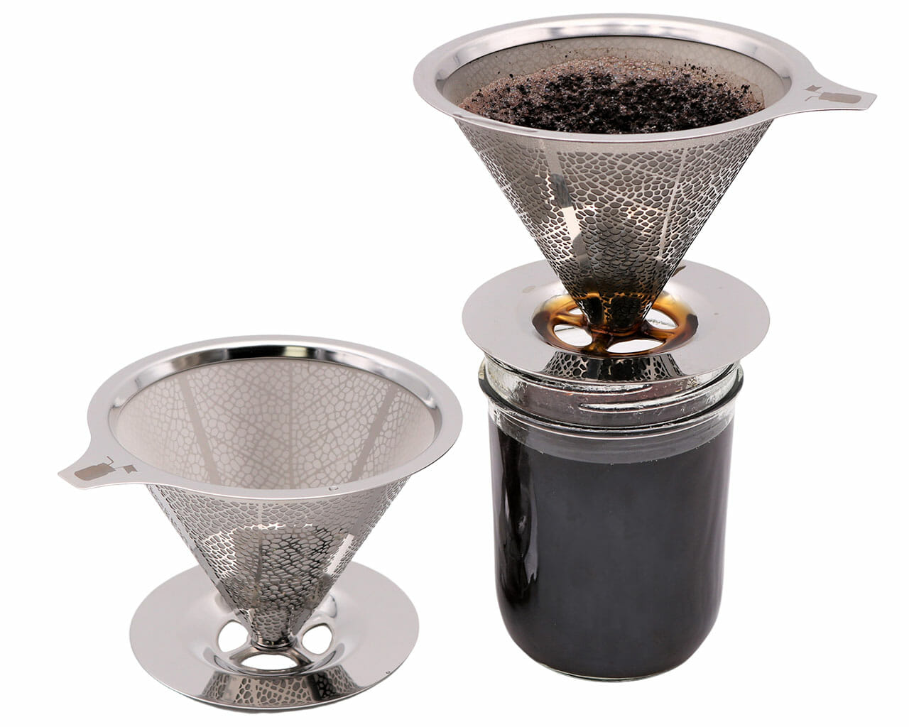 Two Pour Over Drip Coffee Stainless Steel Filters for Mason Jars by Mason Jar Lifestyle are displayed: one empty on a surface, the other brewing coffee as a reusable filter, letting rich coffee drip into the Mason jar below.