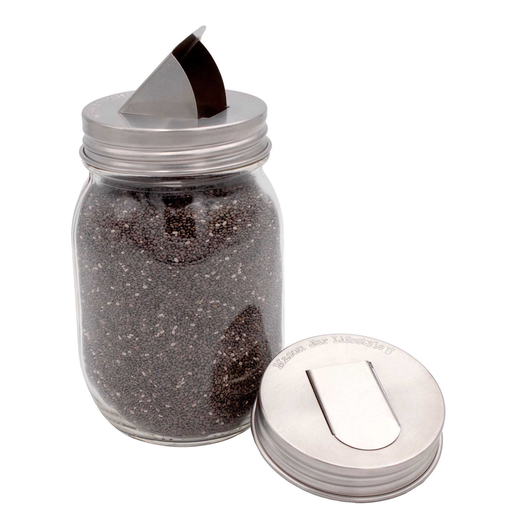 Two stainless steel grain dispenser lids for regular-mouth mason jars, compatible with Mason Jar Lifestyle jars.