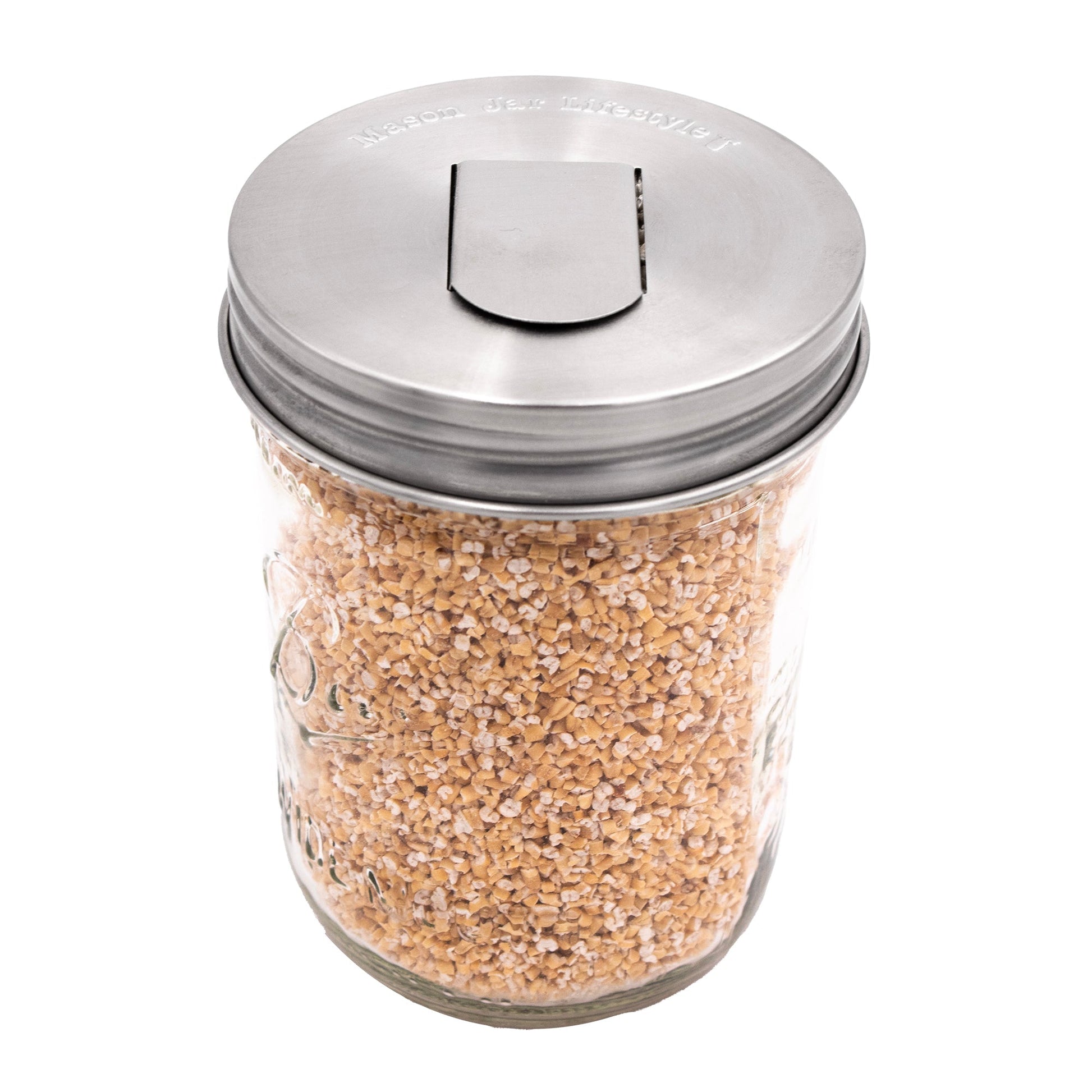 Two stainless steel grain dispenser lids for mason jars, designed for regular-mouth jars, by Mason Jar Lifestyle.