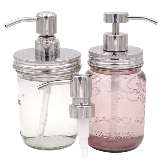 Mason Jar Lifestyle Mirror/Chrome Soap Pump Dispensers for Mason Jars include two stylish jars—one clear, one light pink—with stainless steel pumps and an extra adapter for added convenience.