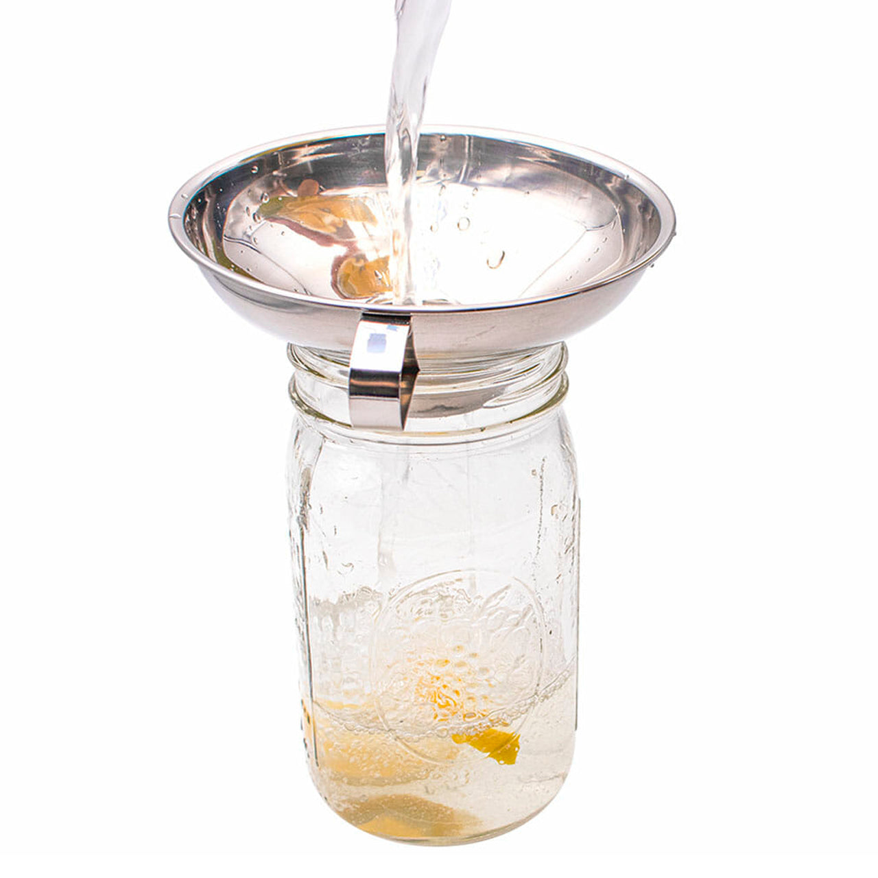 Stainless steel canning funnel for Mason jars, regular mouth pint size, with wide opening for easy pouring of dry goods and liquids.
