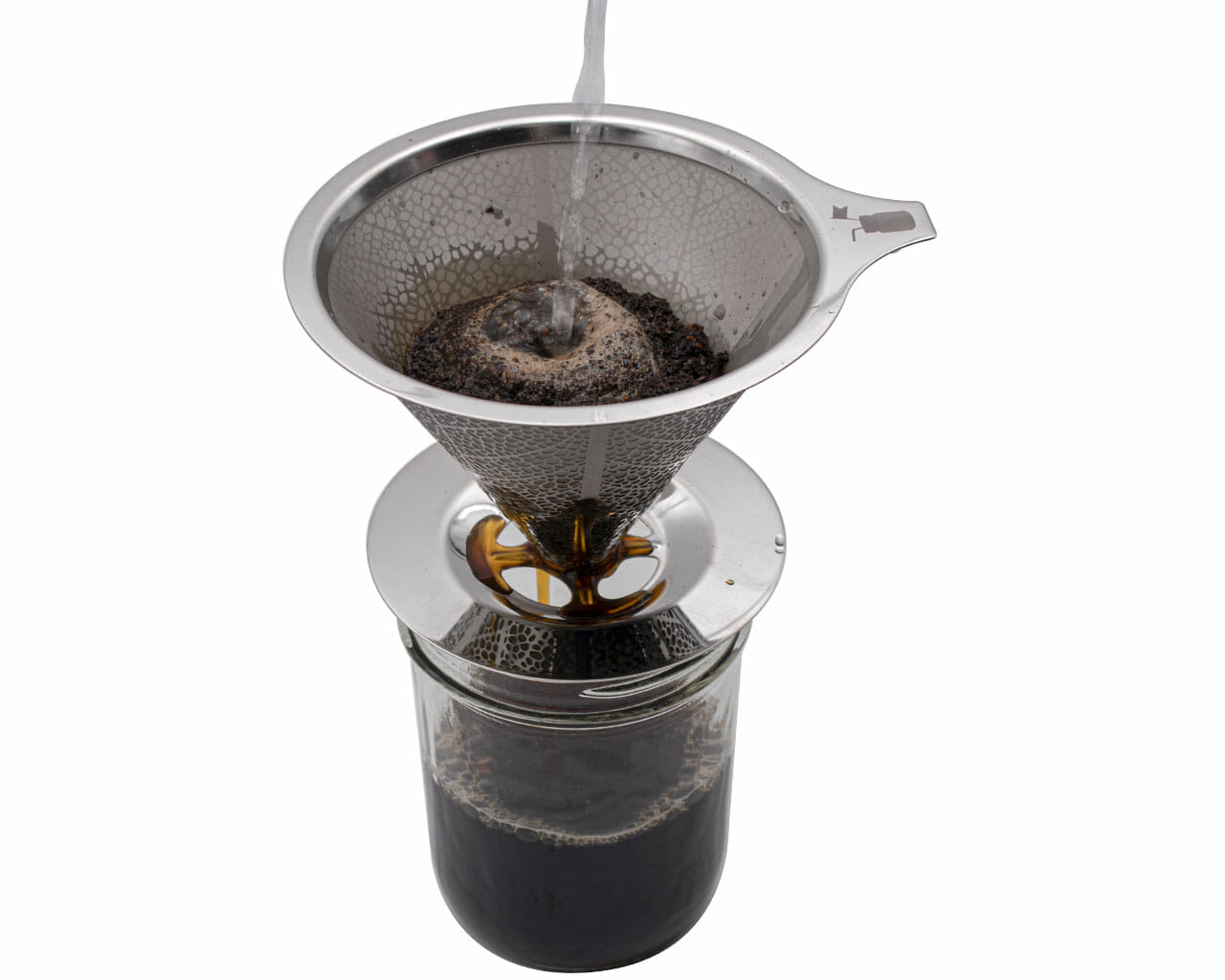 Water is poured through the Mason Jar Lifestyle Pour Over Drip Coffee Stainless Steel Filter filled with ground coffee, set atop a mason jar, to demonstrate manual pour-over brewing.