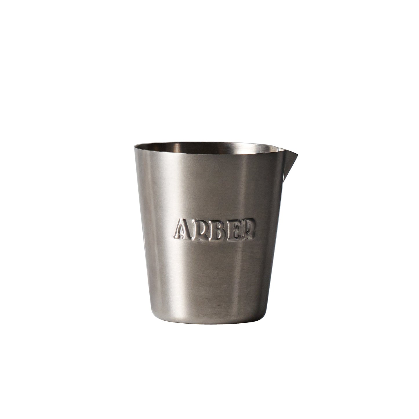 The Arber Measuring Cup features stainless steel construction, a small pouring spout, and ARBER embossed on the front. This garden essential has a brushed metal finish and is shown against a plain white background.