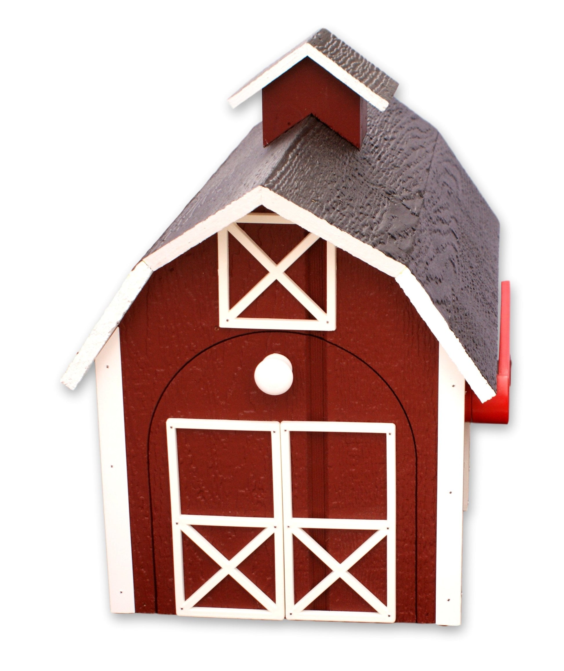 Amish-made wooden Dutch barn style post-mount mailbox with natural finish in a garden setting.