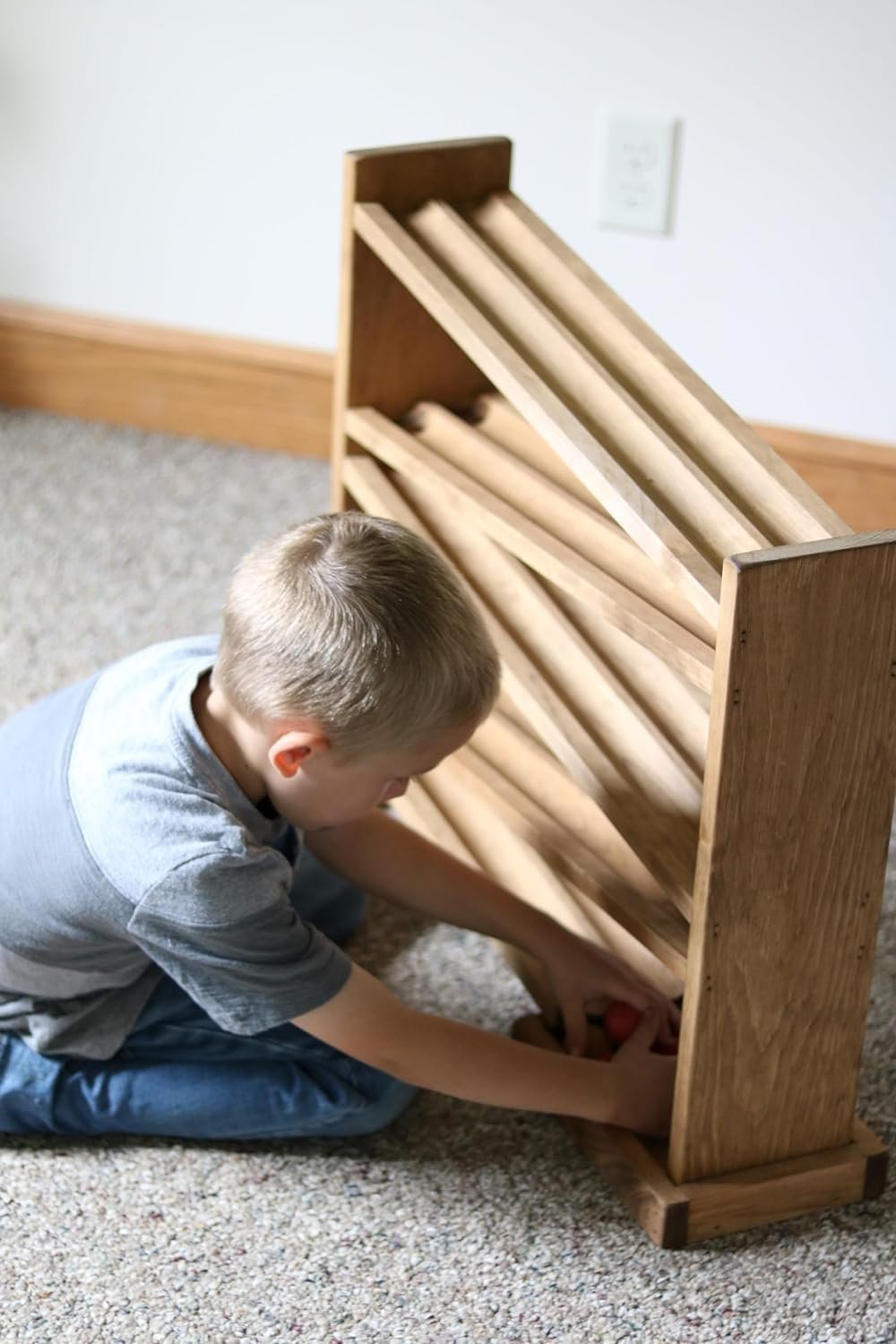 Amish-made wooden ball roller racetrack toy with 8 colorful wooden balls on a smooth wooden track.