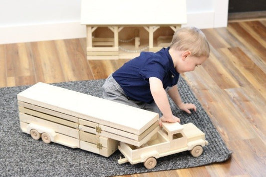 Amish-made wooden toy pickup truck with gooseneck trailer, part of AmishToyBox.com farming wooden toy set, detailed and handcrafted.