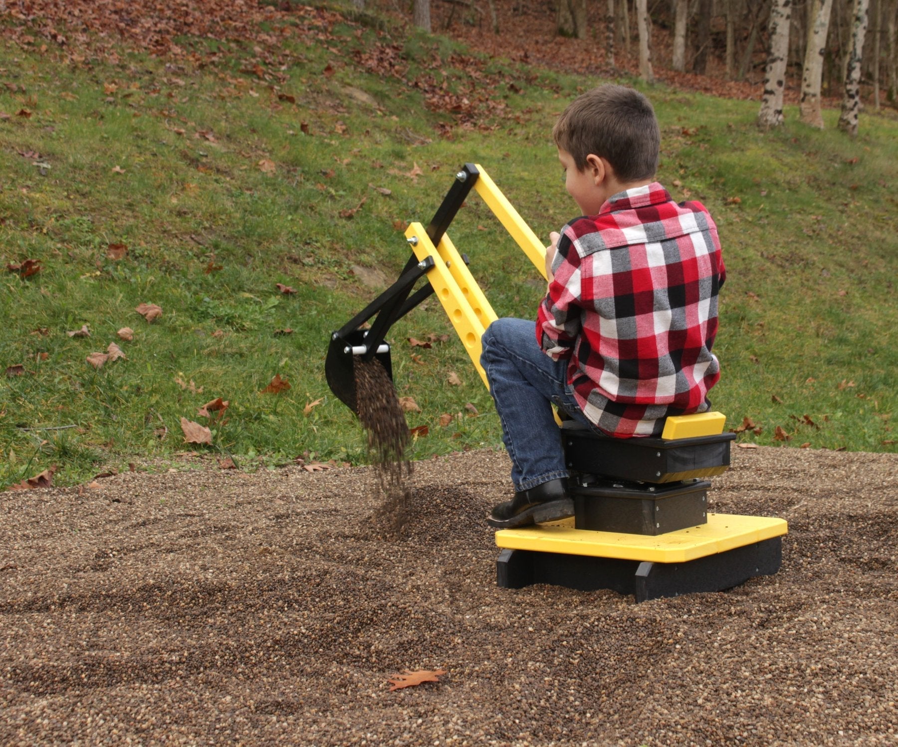 AmishToyBox.com sand digger excavator toy with movable levers and metal digging bucket on a child's play surface.