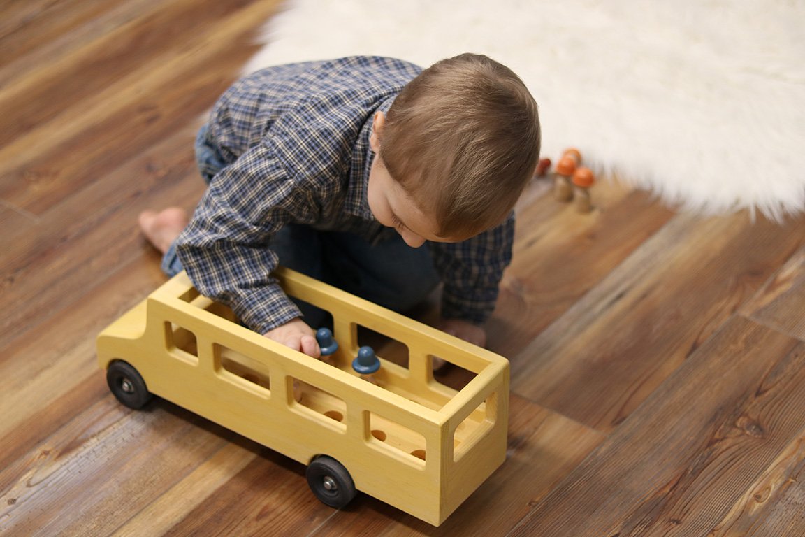Amish-made wooden school bus toy with child-safe finish, part of wooden train and truck collection from AmishToyBox.com.