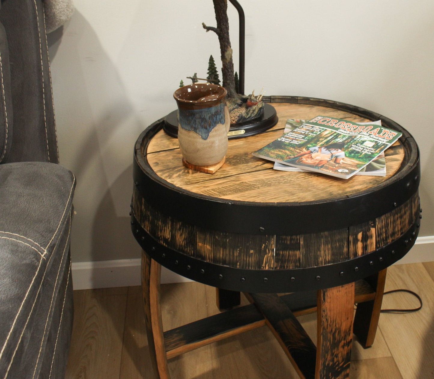 Amish-made rustic barrel-top end table with reclaimed whiskey barrel wood and visible barrel rings, handcrafted for a vintage look.