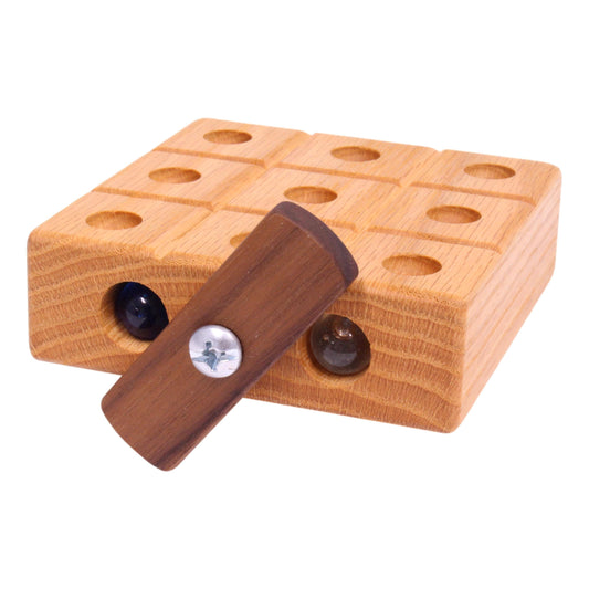 Wooden Tic Tac Toe game with marble storage, handcrafted by AmishToyBox.com, featuring a smooth wooden finish and embedded game grid.