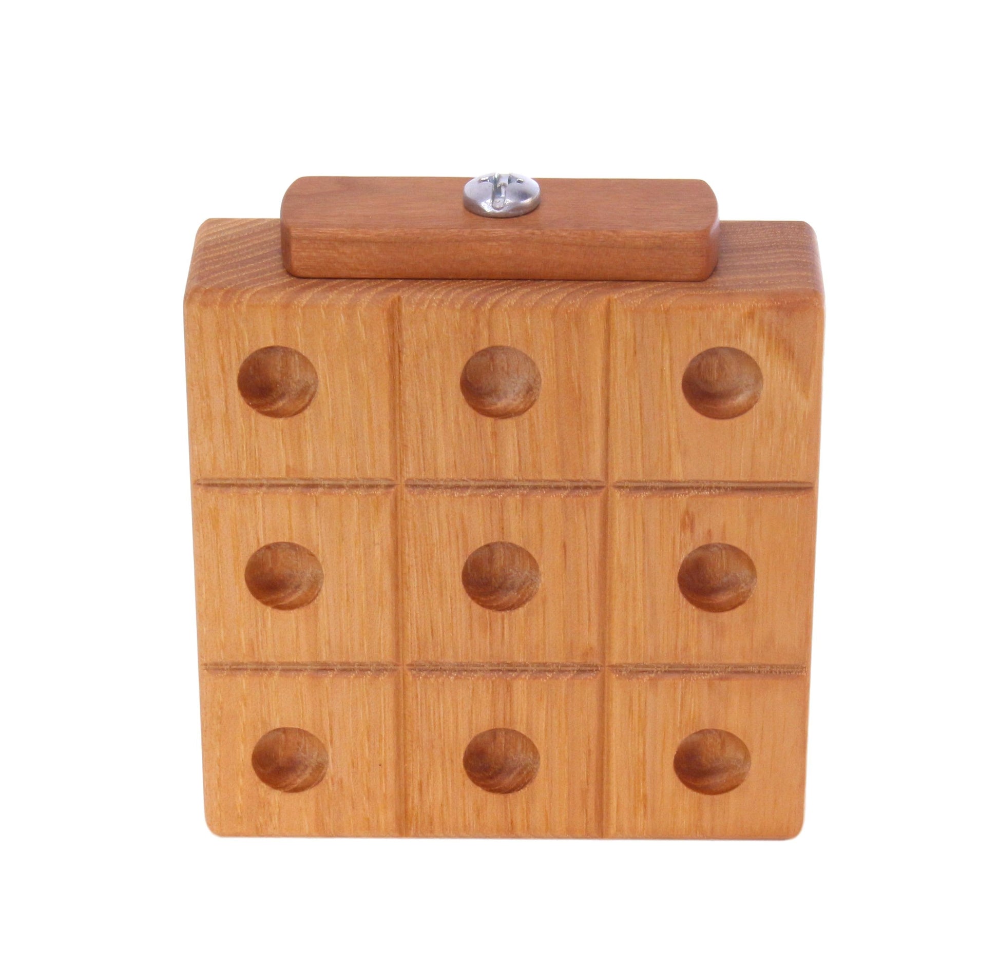 Wooden Tic Tac Toe game with marble storage, handmade wooden toy featuring a classic game board and built-in marble compartment.