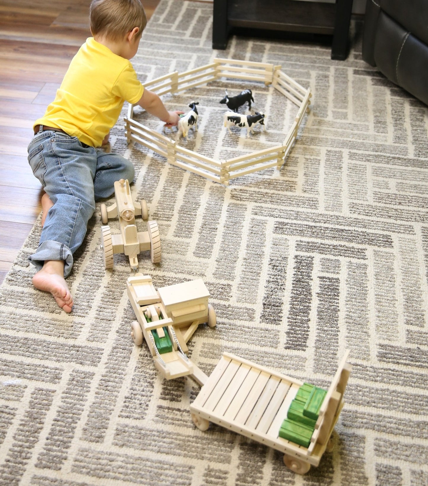 Wooden toy tractor, hay baler, hay wagon, and 16 hay bales from AmishToyBox.com Little Farmer Hay Baling Toy Set.