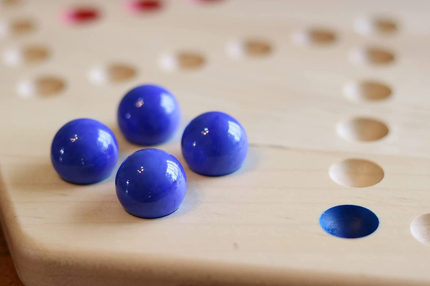 Hand-painted Wahoo marble board game by AmishToyBox.com, double-sided wooden game with colorful marble pathways.