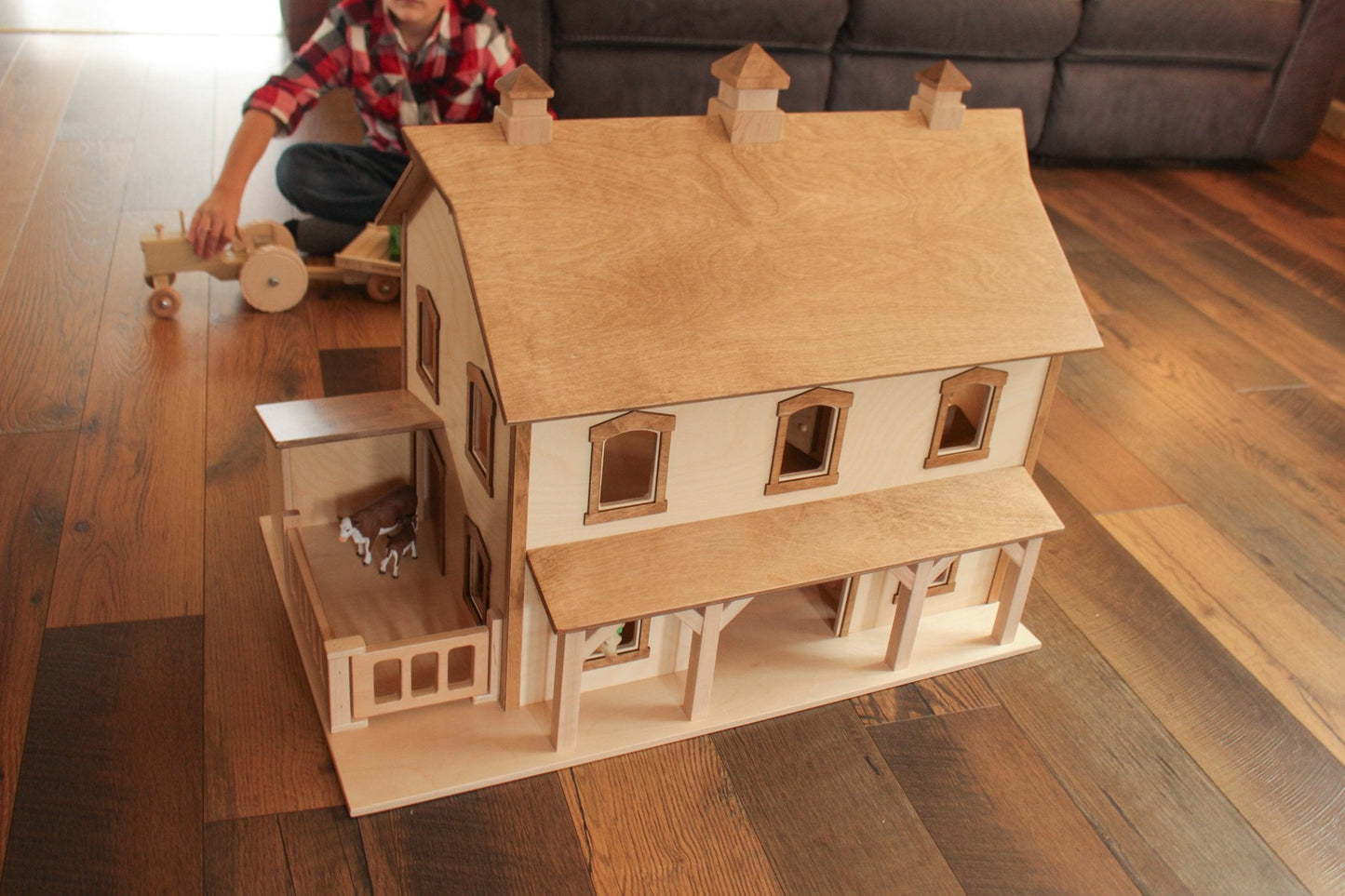 Hand-crafted Pennsylvania bank barn toy by AmishToyBox.com, featuring detailed wooden construction and classic barn design.