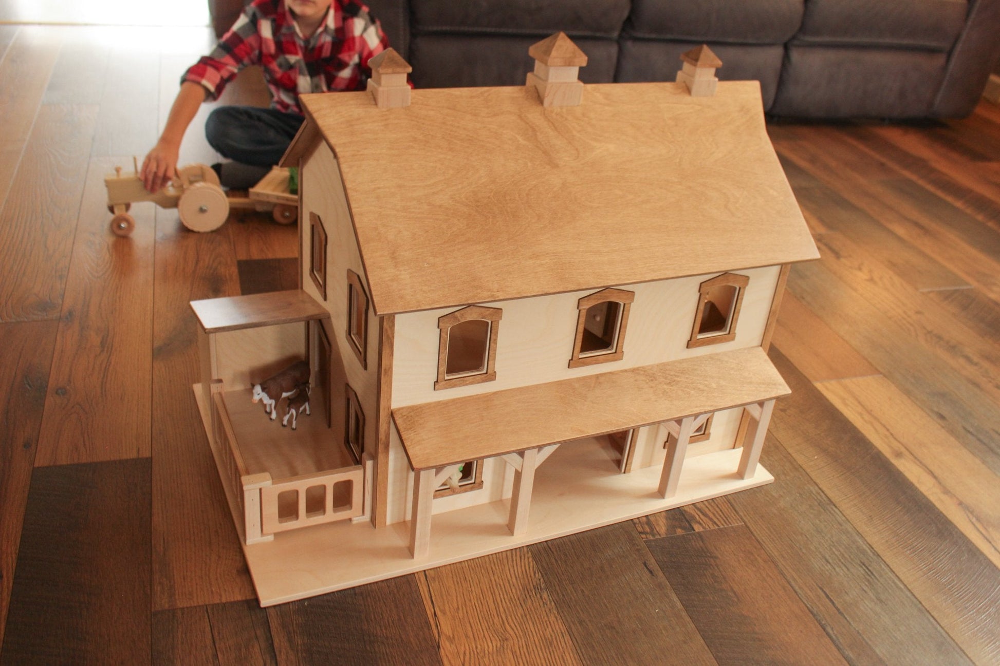 Hand-crafted Pennsylvania bank barn toy by AmishToyBox.com, featuring detailed wooden construction and classic barn design.