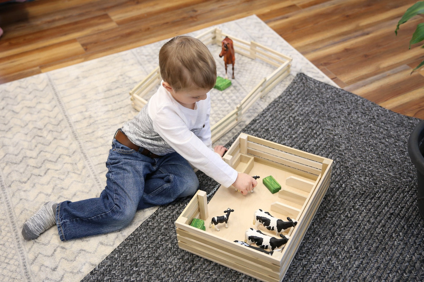 Amish-made wooden mini stockyard toy with seven stalls, ideal for farming play and educational activities.