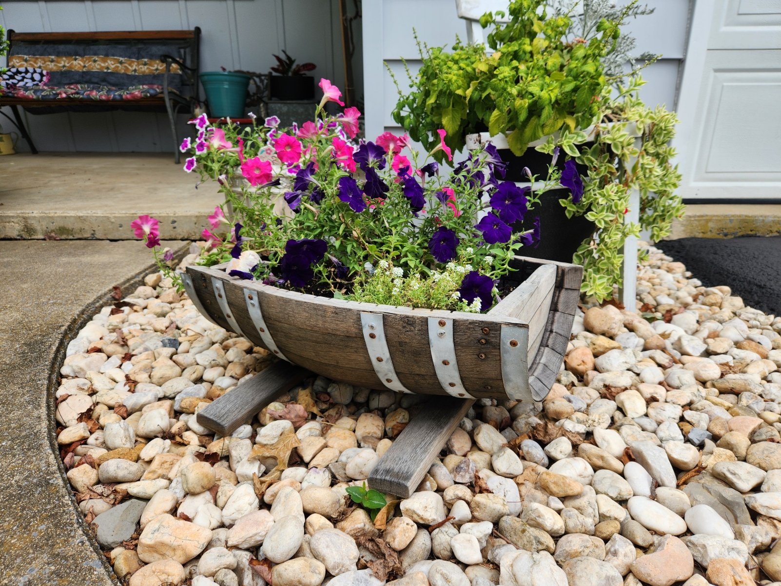 Rustic flower planter made from white oak whiskey barrels by AmishToyBox.com, suitable for indoor or outdoor use.