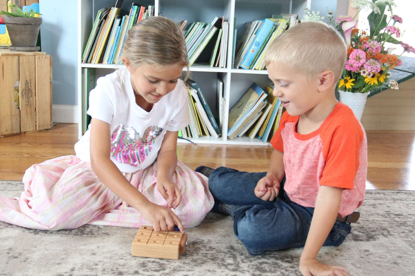 Wooden Tic Tac Toe game with built-in marble storage, featuring smooth wooden pieces and a classic design by AmishToyBox.com.