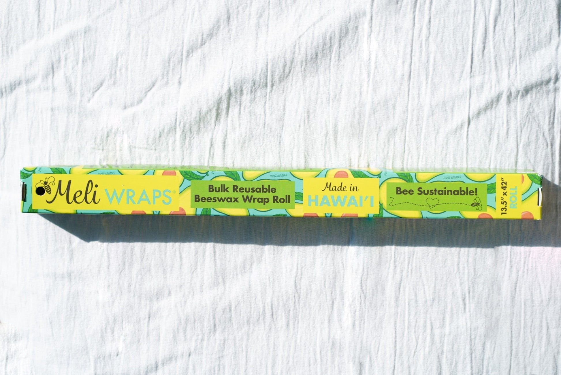Beeswax Wrap Bulk Roll from Meli Wraps with avocado print, reusable beeswax food wrap for eco-friendly storage.