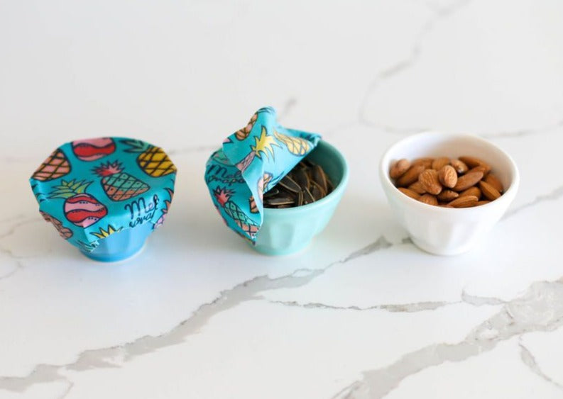 Beeswax Wrap Bulk Roll by Meli Wraps with pineapple print, reusable beeswax food wraps in a large roll on a white background.