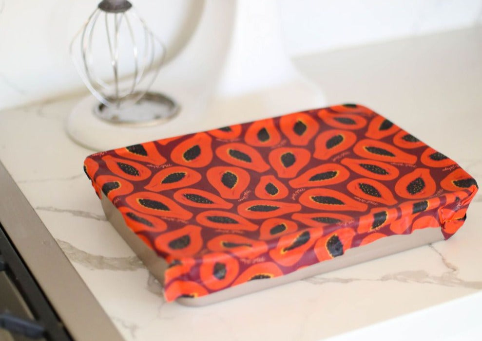 Meli Wraps beeswax rolls in purple papaya print, bulk pack of natural beeswax wraps for food storage, eco-friendly and reusable.