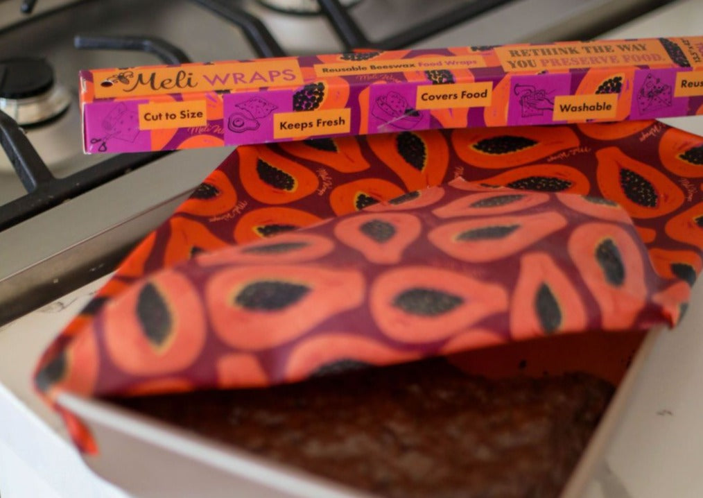 Meli Wraps beeswax roll with purple papaya print, bulk pack of reusable beeswax wraps for food storage.