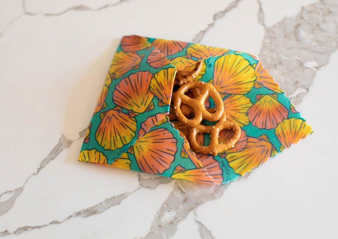 Meli Wraps beeswax wrap bulk roll with shells print, natural beeswax-coated food wrap for eco-friendly storage.