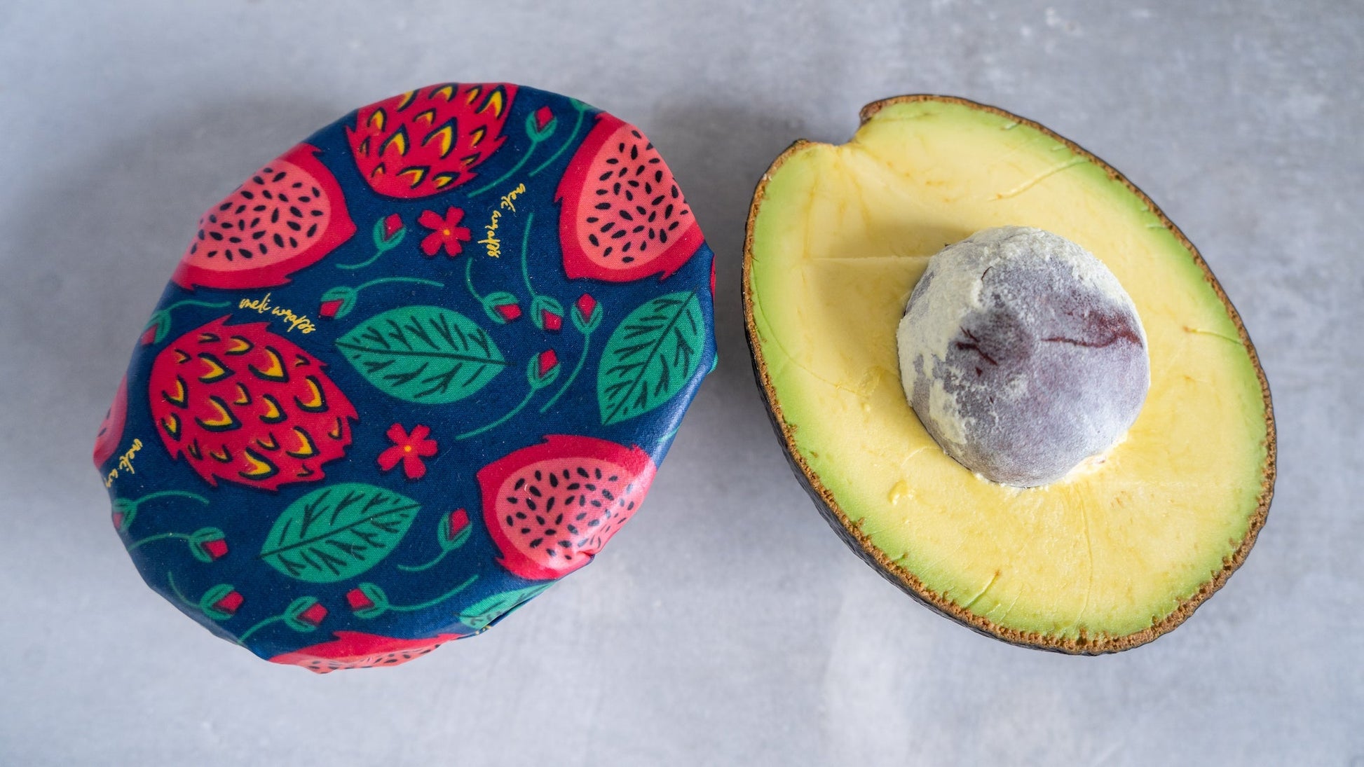 Set of Meli Wraps beeswax food wraps in small, medium, and large sizes with vibrant dragonfruit print for food storage.