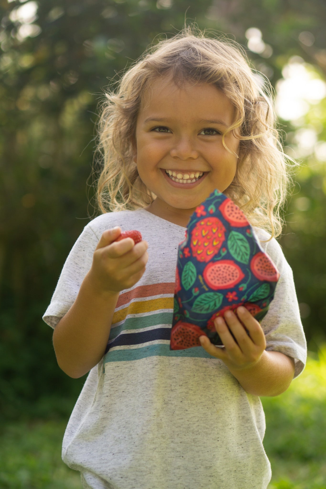 Set of Meli Wraps beeswax food wraps with vibrant dragonfruit print in small, medium, and large sizes for food storage.
