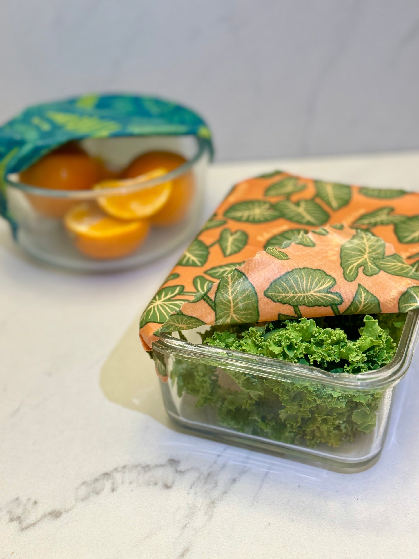 Set of Meli Wraps beeswax food wraps in small, medium, and large sizes with colorful Kalo print designs.