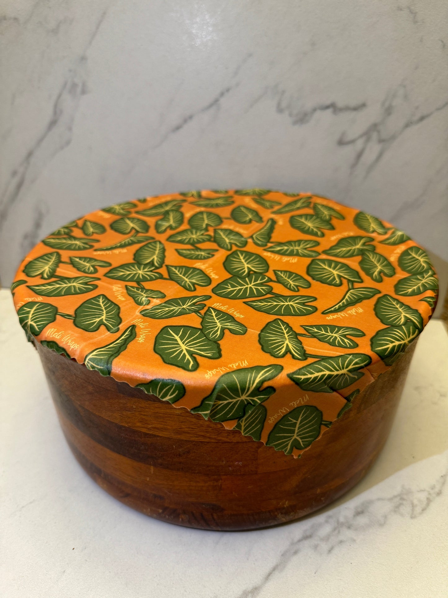 Set of three Meli Wraps beeswax food wraps with colorful Kalo print in small, medium, and large sizes for food storage.