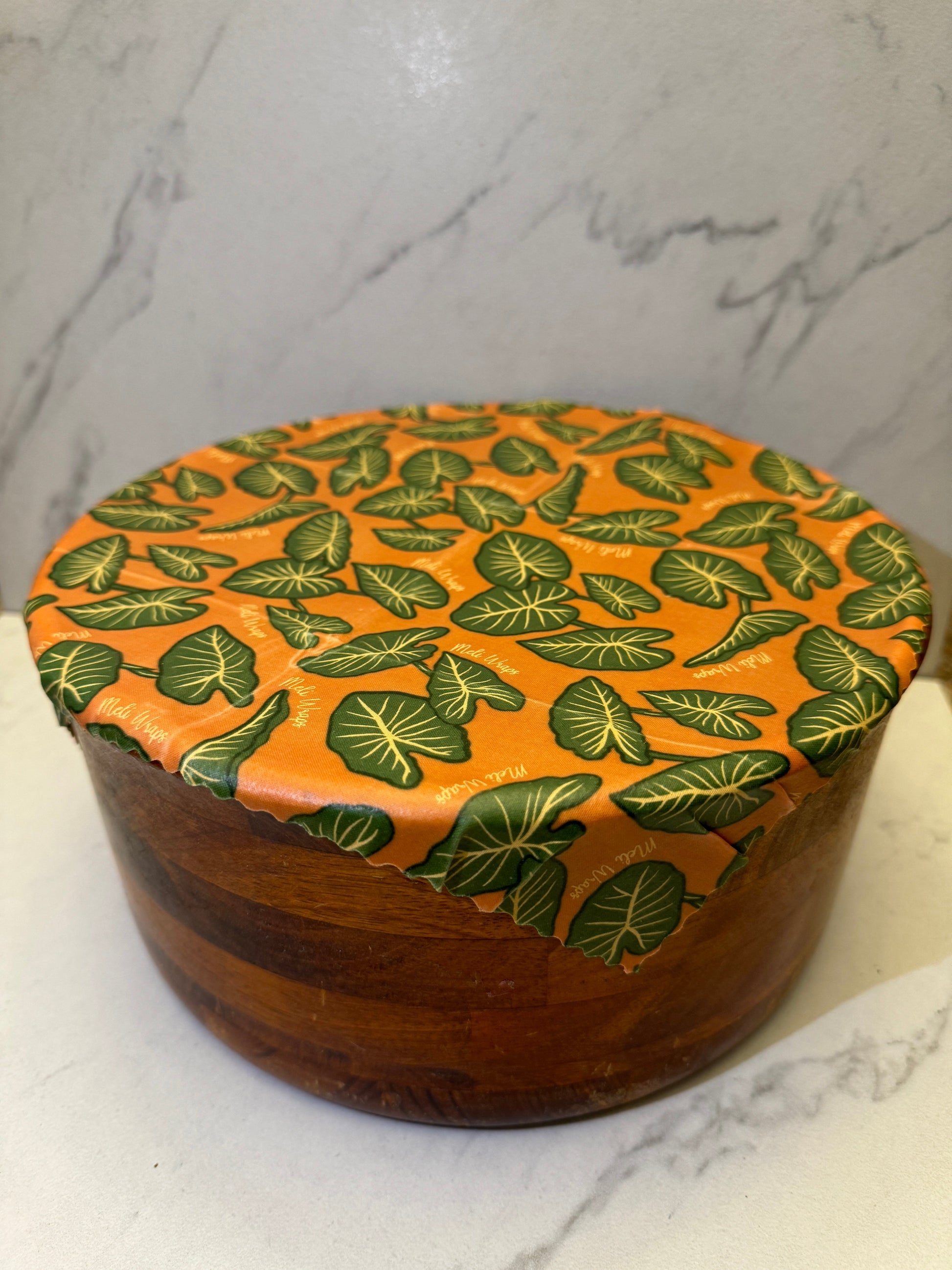 Set of three Meli Wraps beeswax food wraps with colorful Kalo print in small, medium, and large sizes for food storage.
