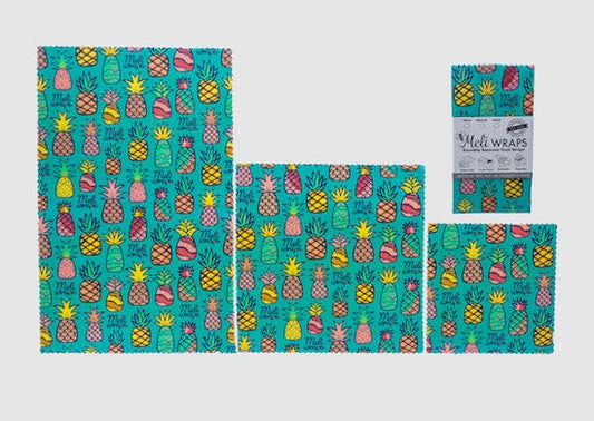 Set of Meli Wraps beeswax food wraps in pineapple print, including small, medium, and large sizes for food storage.
