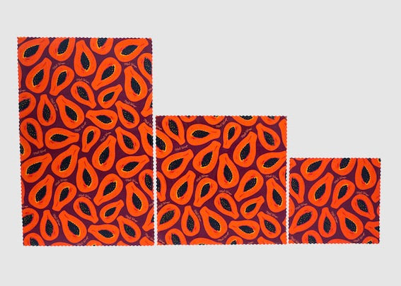 Set of Meli Wraps beeswax food wraps in purple papaya print, featuring small, medium, and large sizes for food covering and storage.